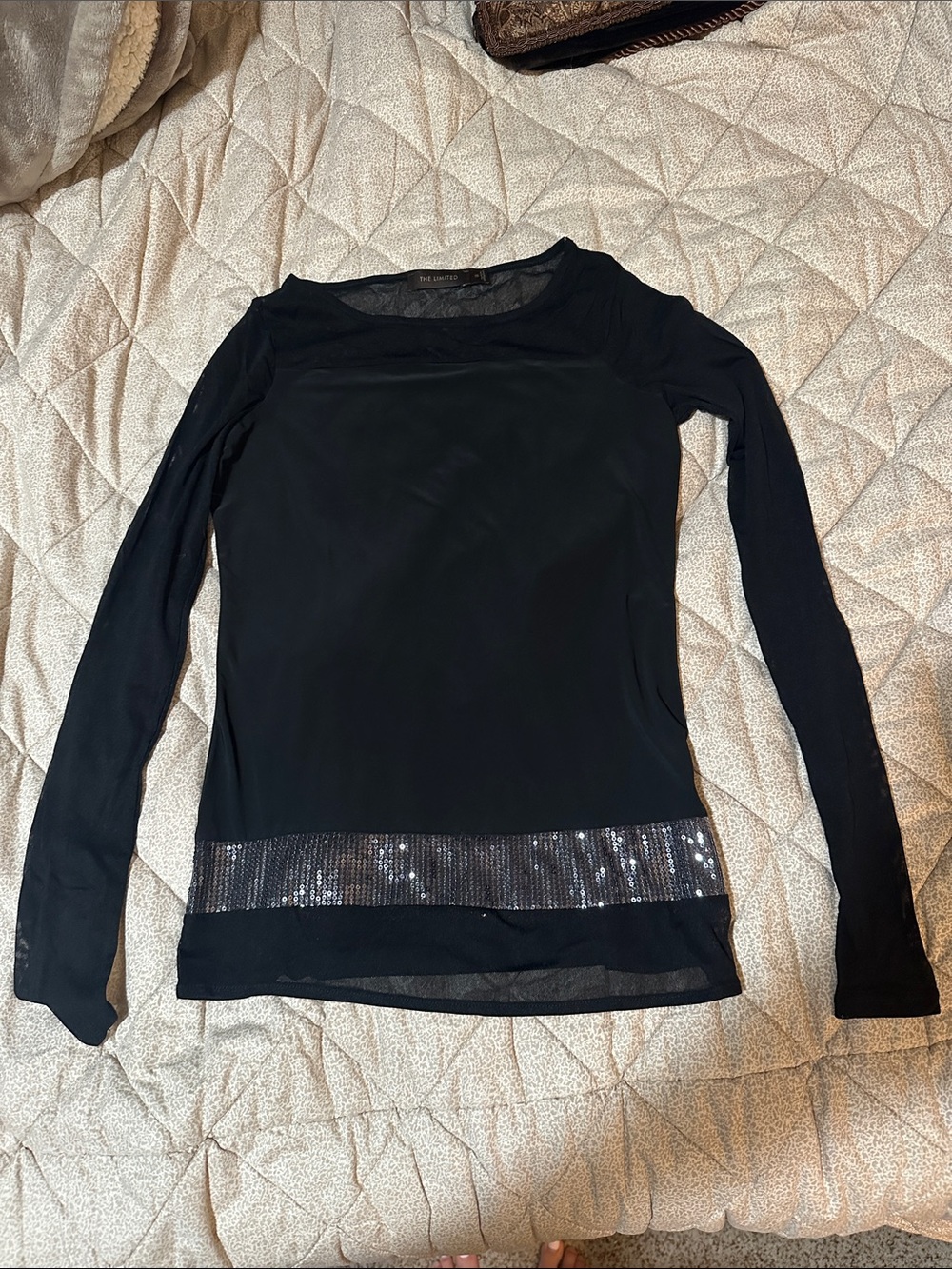 The Limited Black Long-Sleeve Top with Sequin Hem